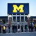A long line to enter Crisler Arena for a watch party wraps around The Big House on Monday, April 8. Daniel Brenner I AnnArbor.com